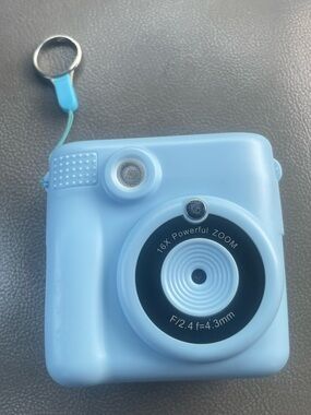 Portable Mini Digital Camera - Light Blue uses thermal paper